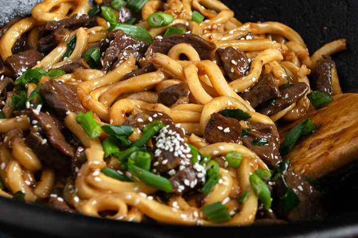 Mongolian Beef Udon in cast iron wok