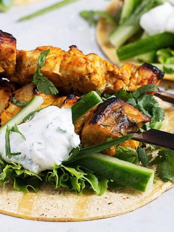 chicken tikka tacos on board