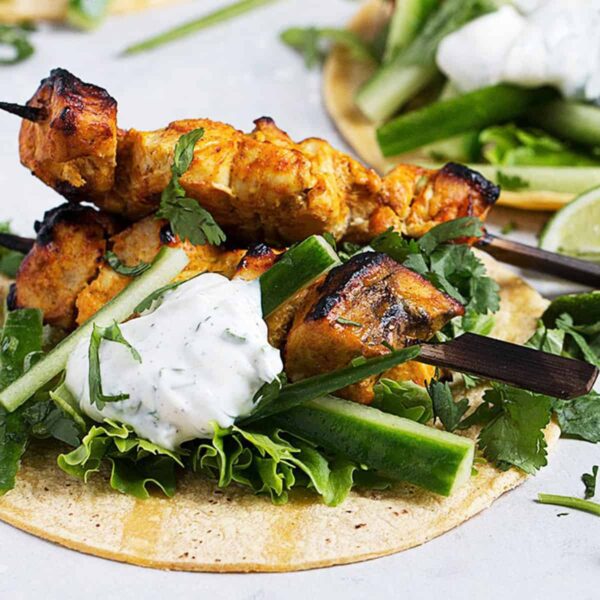 chicken tikka tacos on board