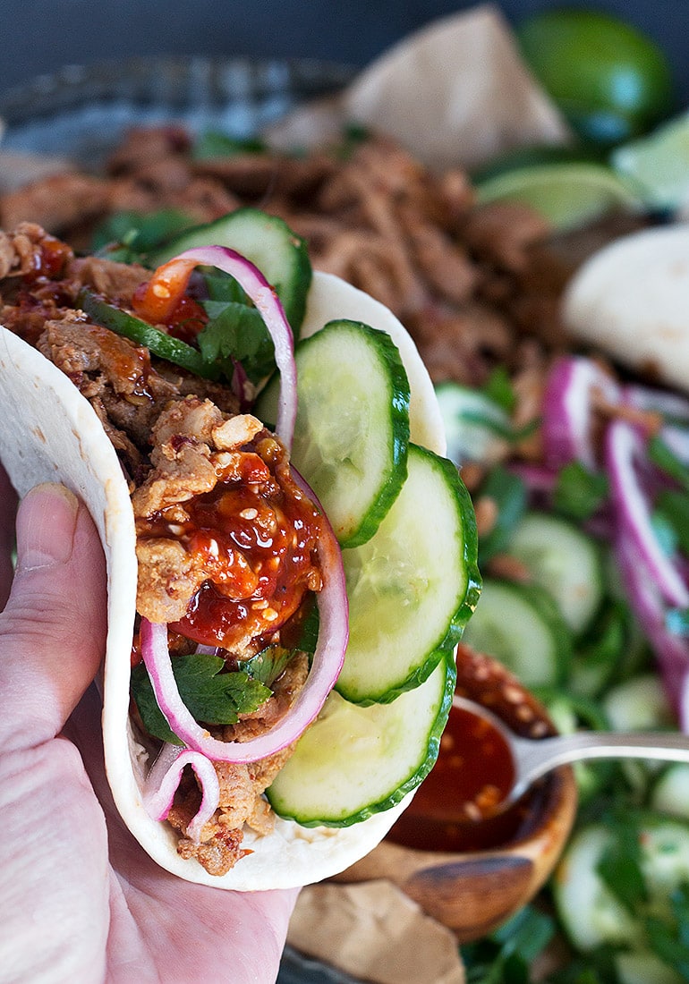 spicy pork taco in hand