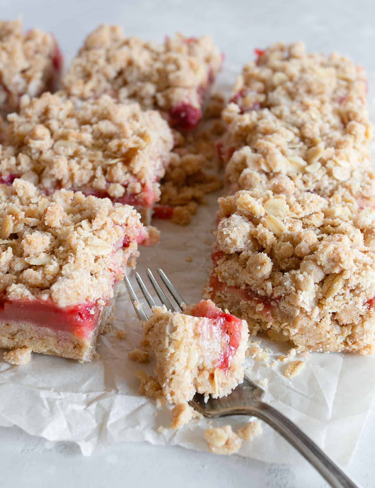 strawberry rhubarb squares cut on parchment