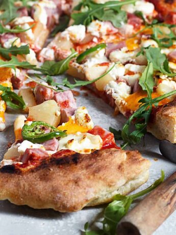 three cheese Hawaiian pizza sliced