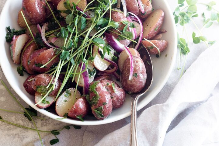 mini red potato salad in white bowl