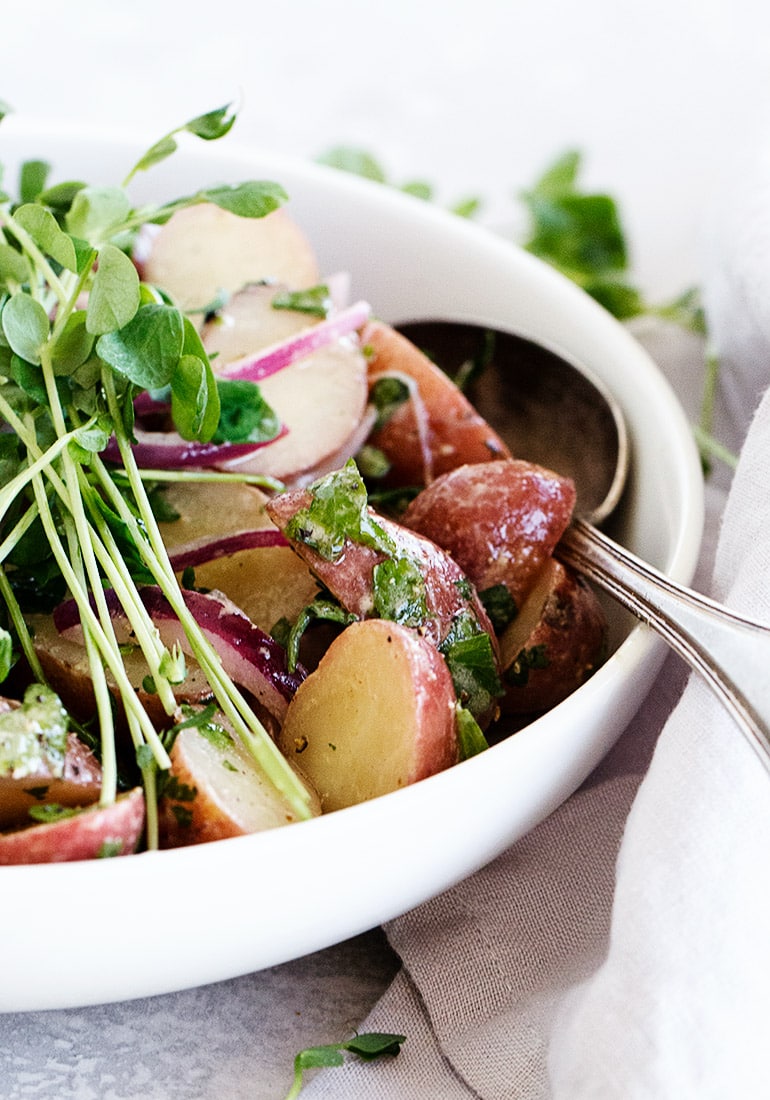 mini red potato salad in white bowl