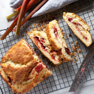 roasted rhubarb biscuit roll sliced on cooling rack