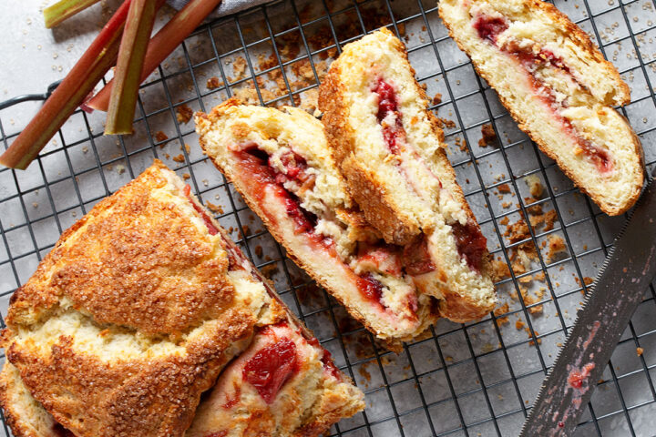 roasted rhubarb biscuit roll sliced on cooling rack
