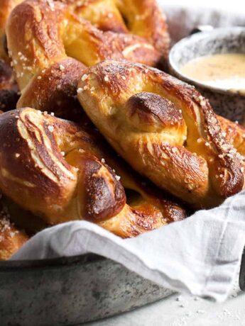 soft pretzels on tray with a cup of beer cheese
