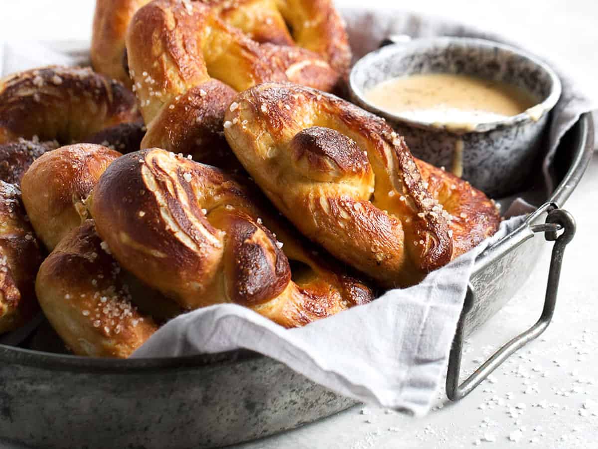 soft pretzels on tray with a cup of beer cheese