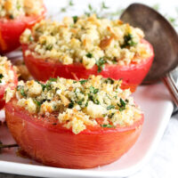 baked tomatoes with crumb topping on plate