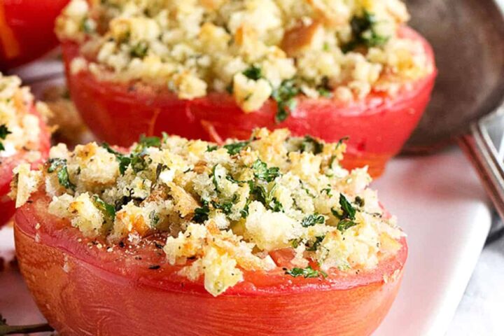 baked tomatoes with crumb topping on plate