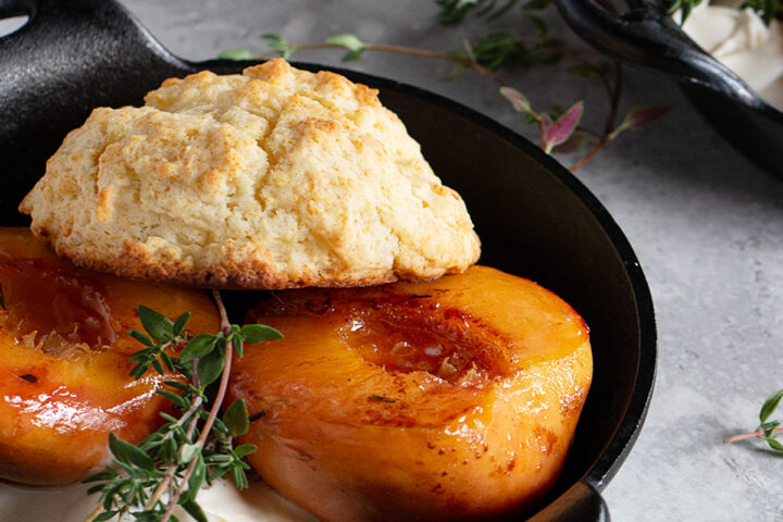 maple glazed peaches in dishes with biscuits