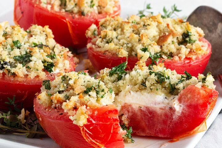 tomatoes stuffed with goat cheese on plate