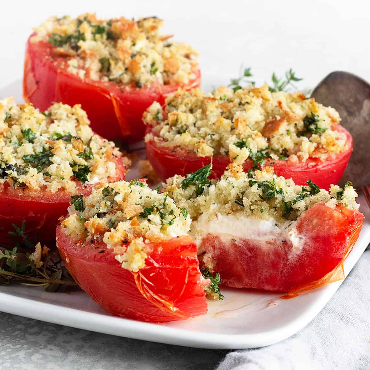 tomatoes stuffed with goat cheese on plate