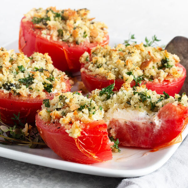 tomatoes stuffed with goat cheese on plate