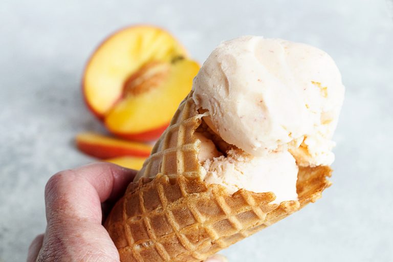 fresh peach ice cream in cone