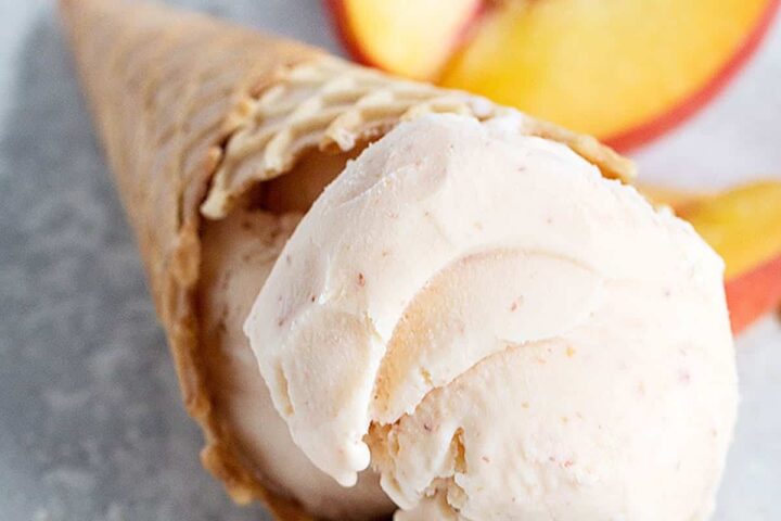 peach ice cream in cone