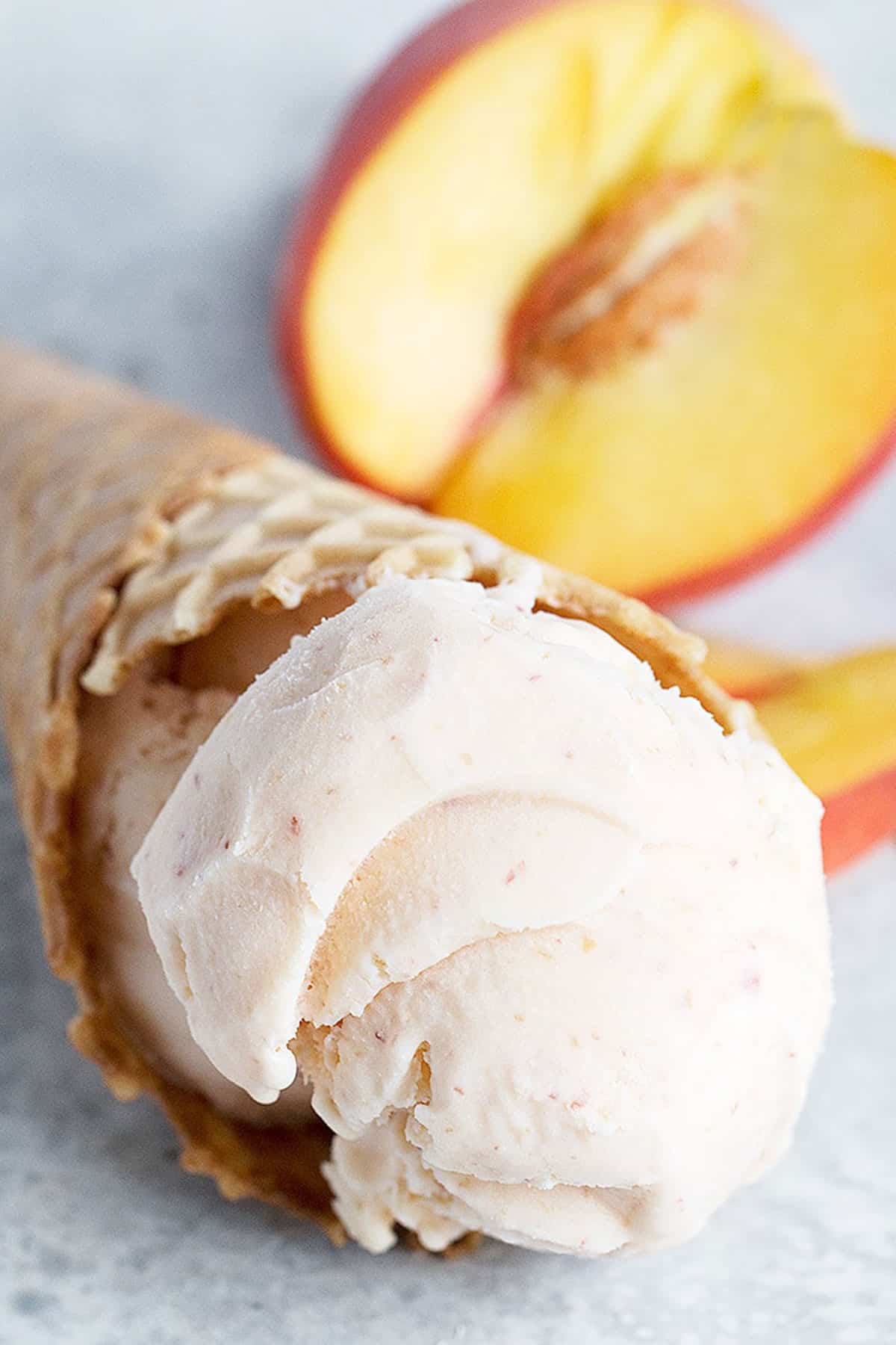peach ice cream in cone