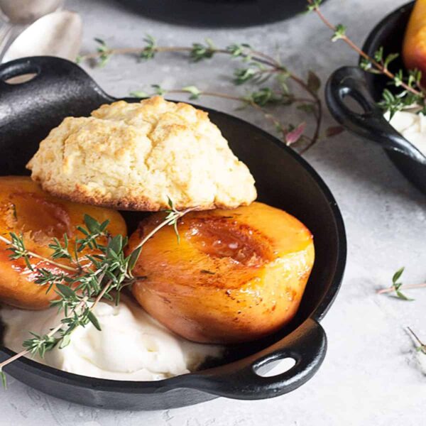 grilled peaches with biscuits in skillets
