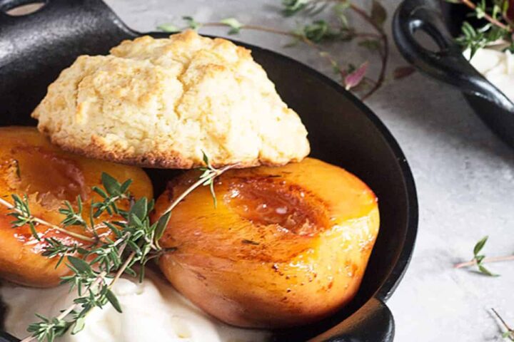 grilled peaches with biscuits in skillets