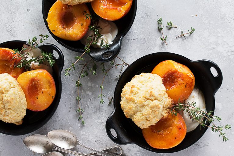 glazed peaches and biscuits in cast iron skillet