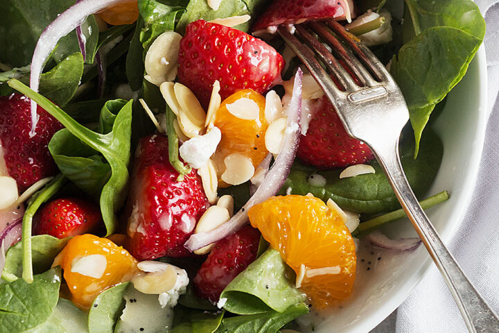 spinach strawberry mandarin salad in bowl