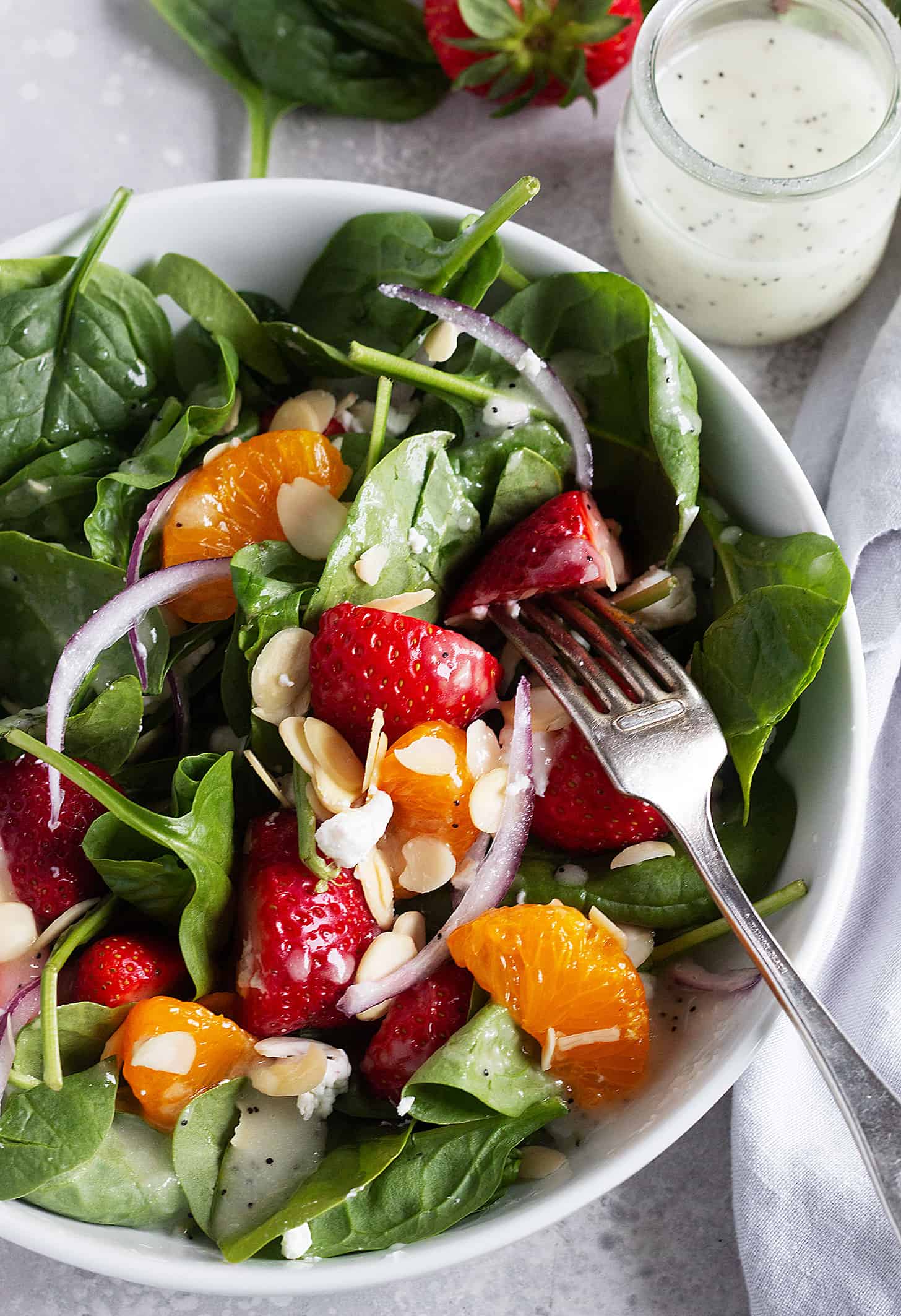 spinach strawberry mandarin salad in bowl