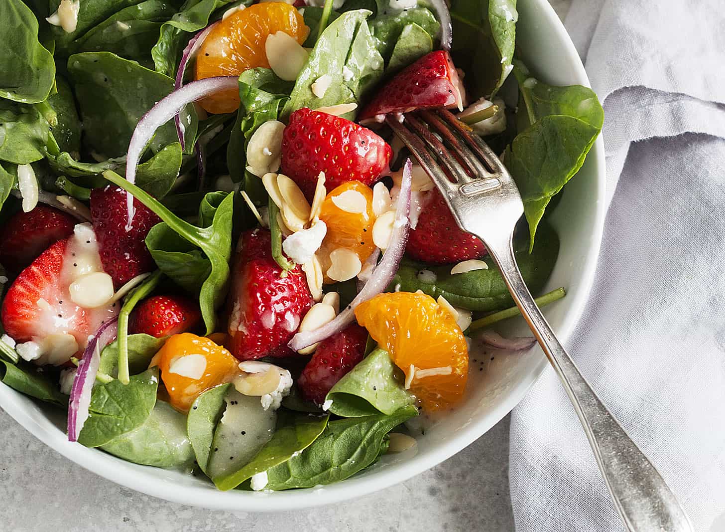 spinach strawberry mandarin salad in bowl