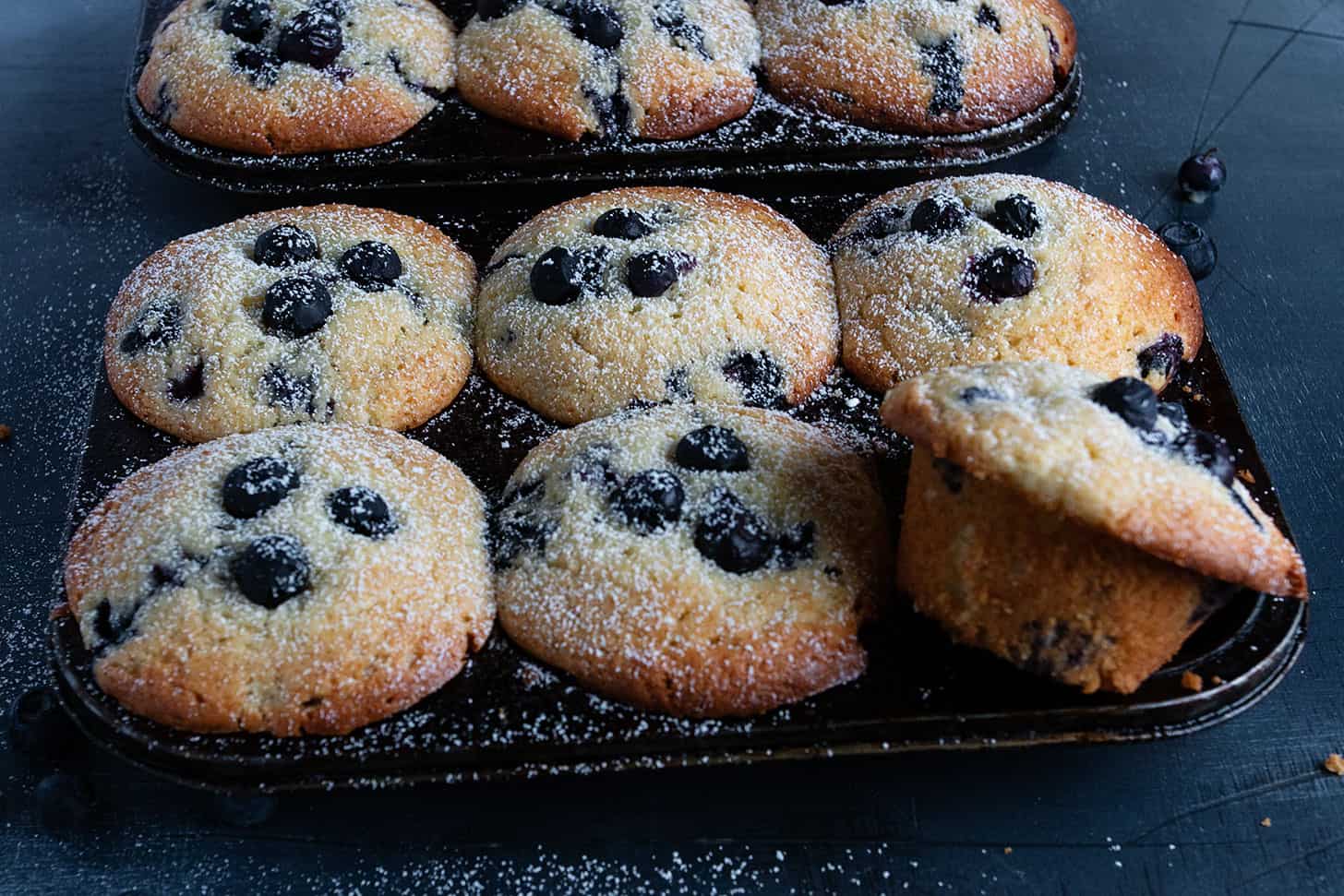 blueberry lemon muffins in muffin tins
