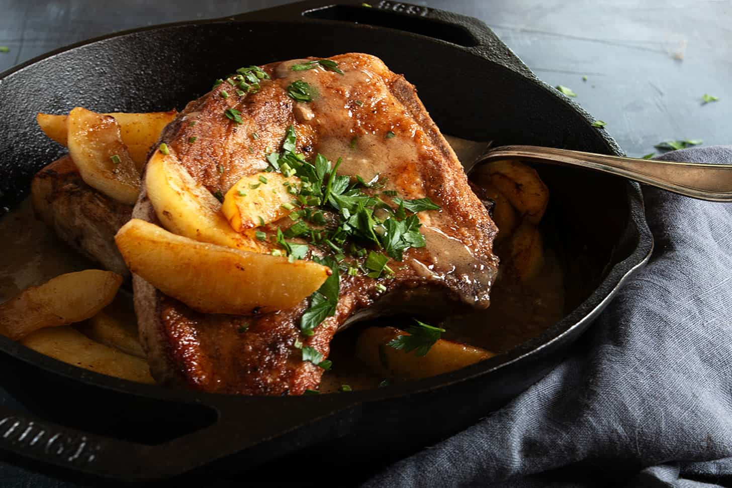 pork chops with apples in cast iron skillet