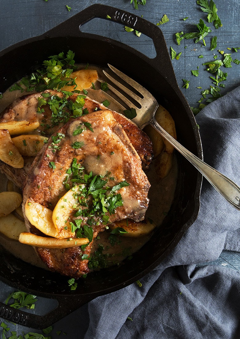 pork chops with sauteed apples in cast iron skillet