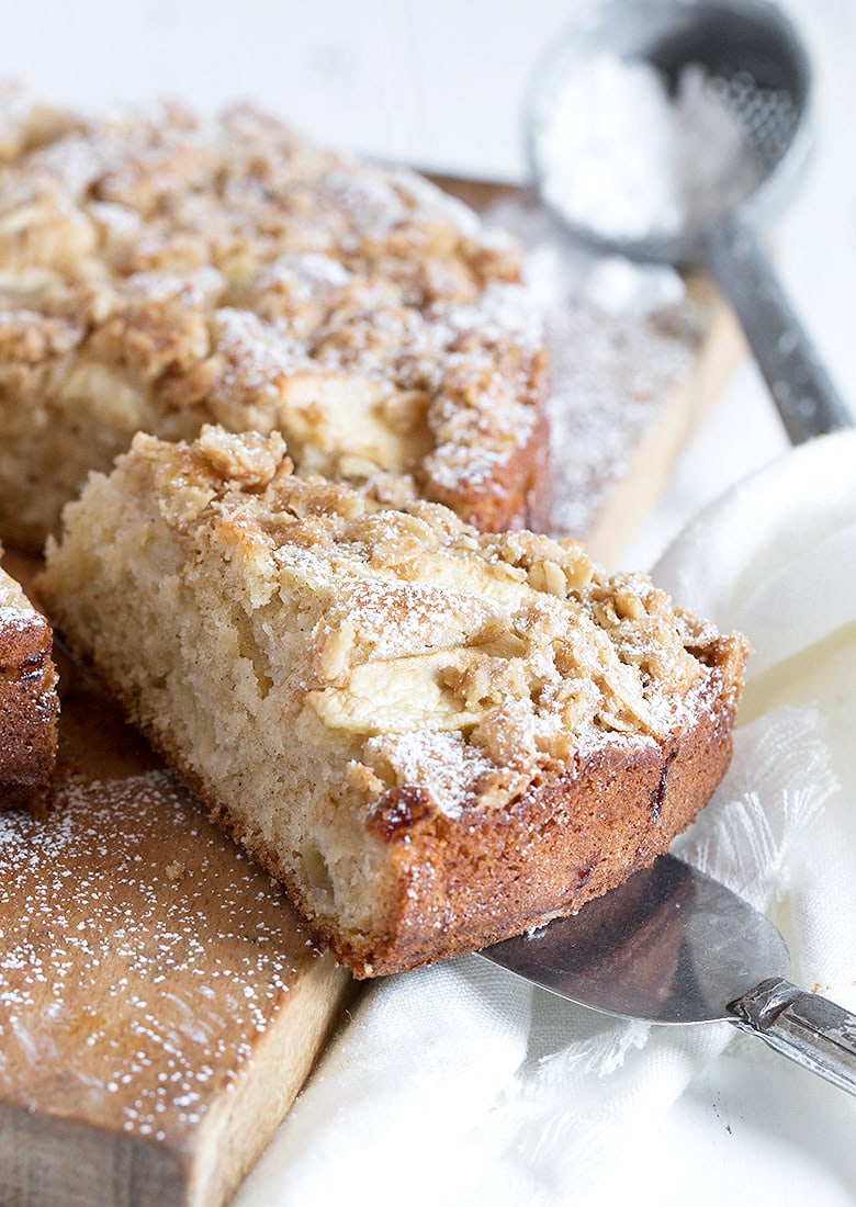 apple cake with crisp topping on cutting board