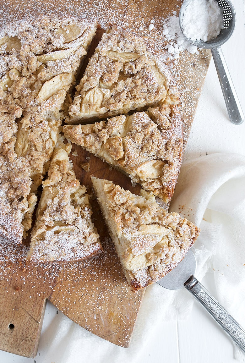 apple cake with crisp topping on cutting board