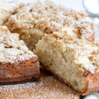 apple cake with crisp topping on cutting board