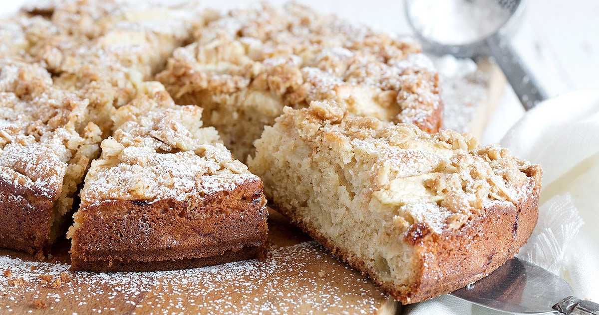 apple cake with crisp topping on cutting board