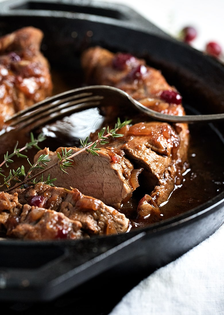 cranberry balsamic pork tenderloin in cast iron skillet