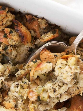 classic bread stuffing in casserole with spoon