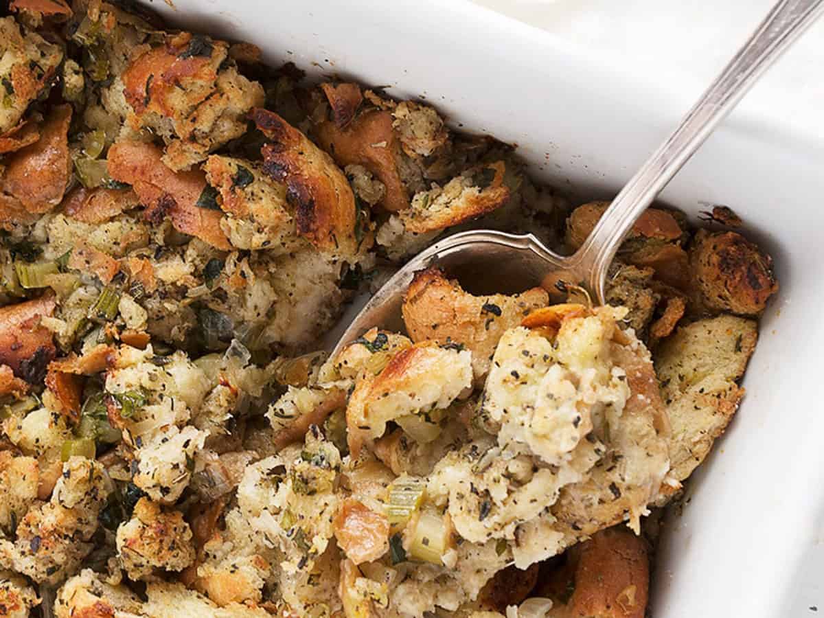 classic bread stuffing in casserole with spoon