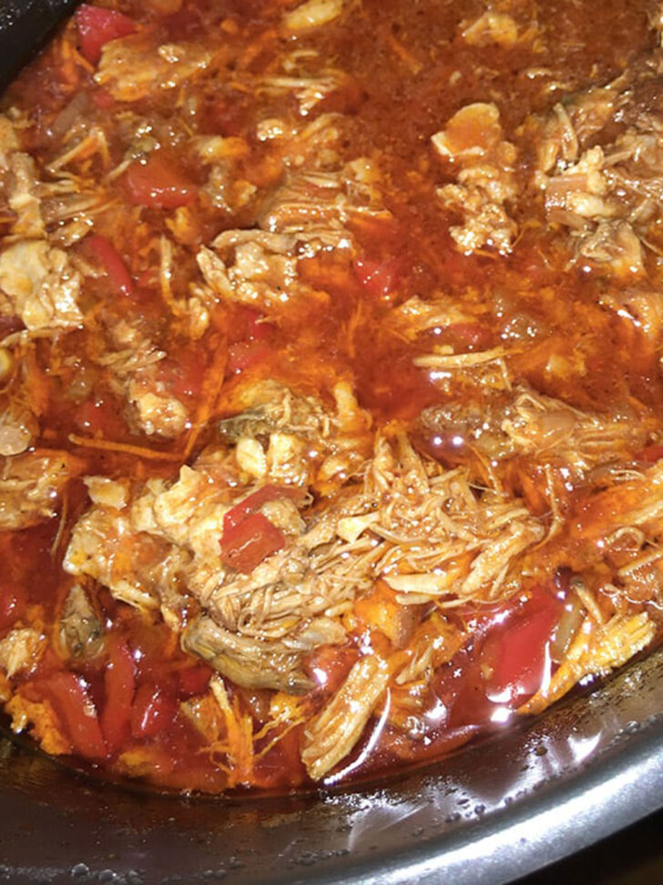 Slow cooker pulled pork after cooking in the slow cooker.