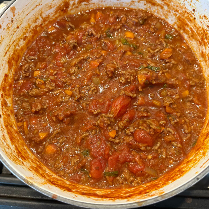 Classic Italian meat sauce simmering in the pot.