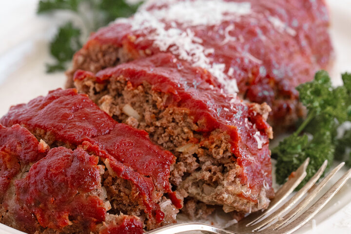 Classic meatloaf sliced on a serving platter.