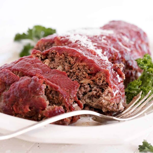 classic meatloaf sliced on white plate