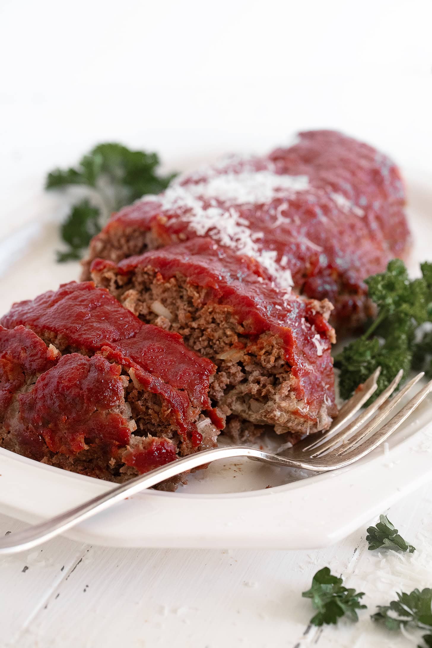 Classic meatloaf sliced on a serving platter.