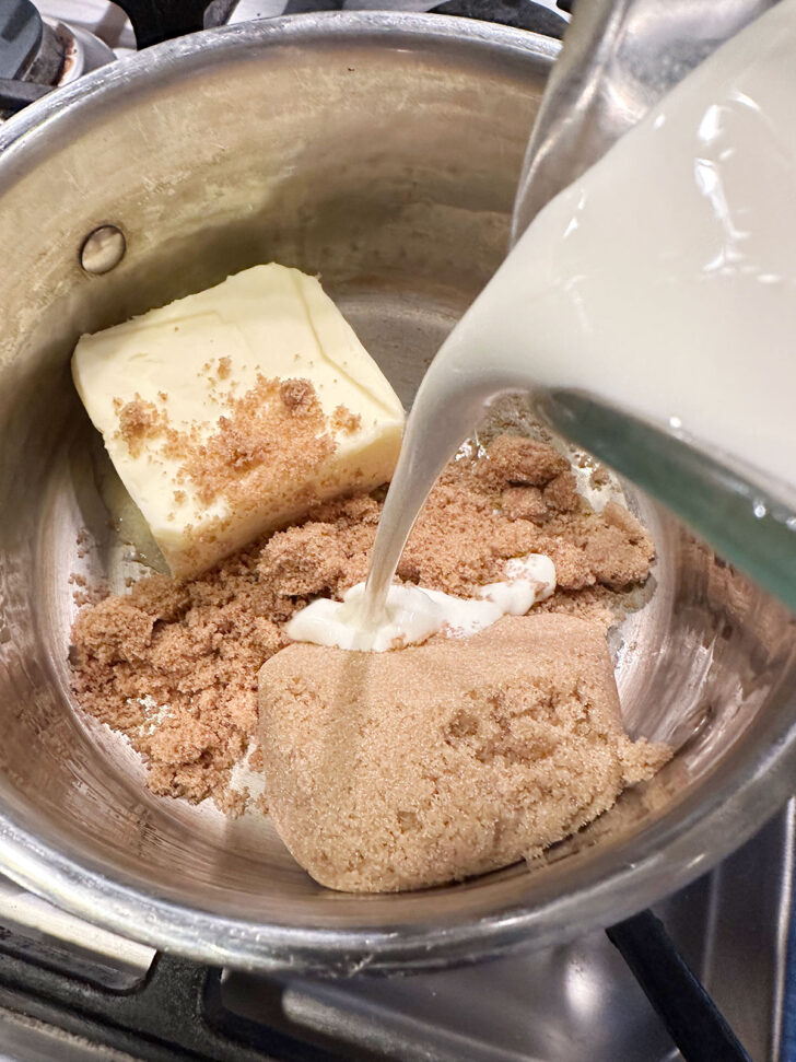 adding cream to saucepan with brown sugar and butter