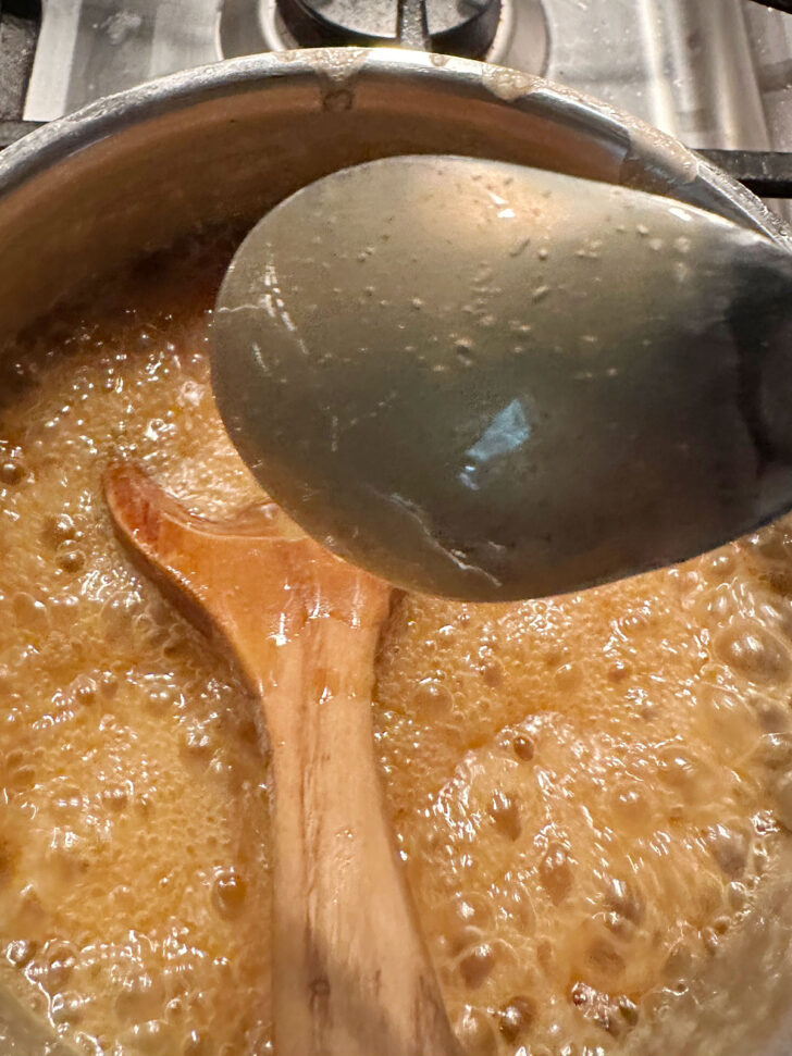 showing the sauce coating the back of a spoon
