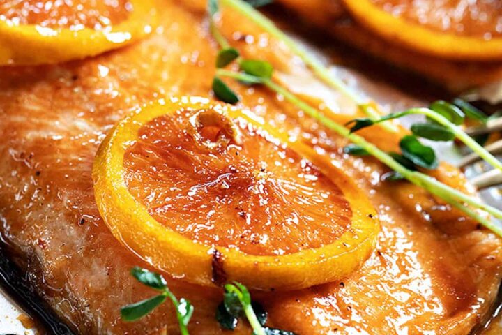 Asian orange salmon on baking sheet