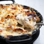 cauliflower cheese in cast iron skillet