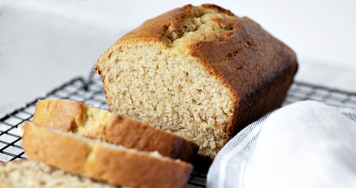 banana bread on cooling rack, sliced