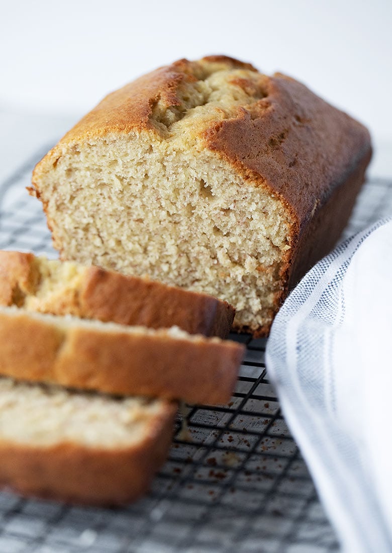 banana bread on cooling rack, sliced