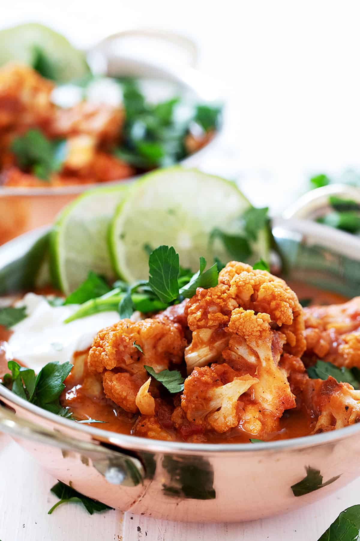 Indian cauliflower curry in copper bowls