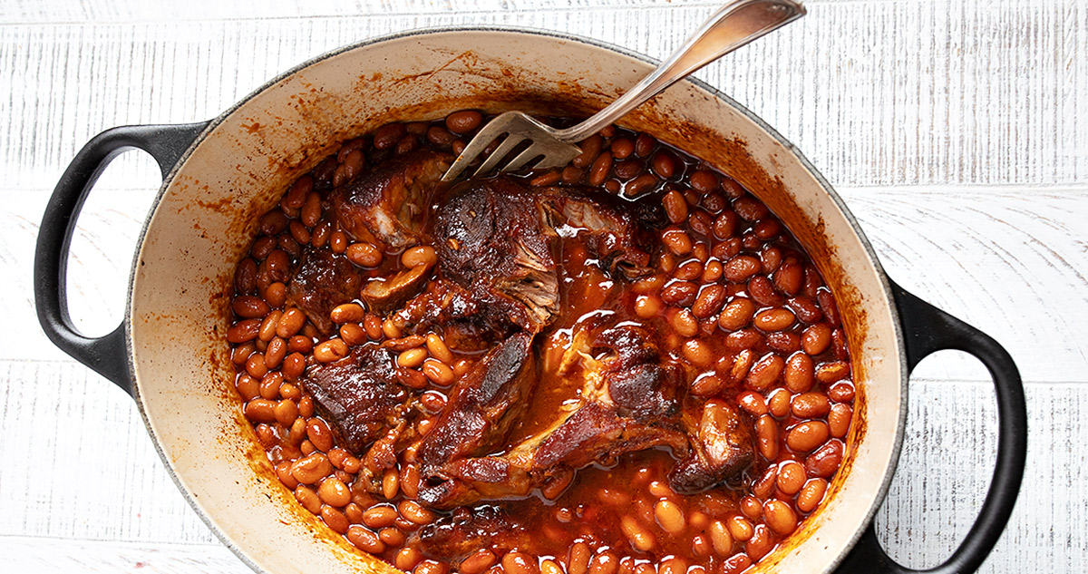 pork and beans in a Dutch oven